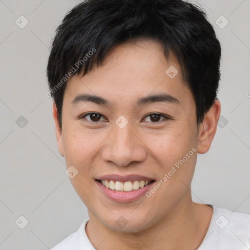 Joyful asian young-adult male with short  brown hair and brown eyes