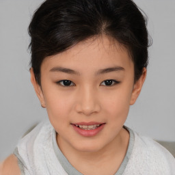 Joyful white child female with short  brown hair and brown eyes