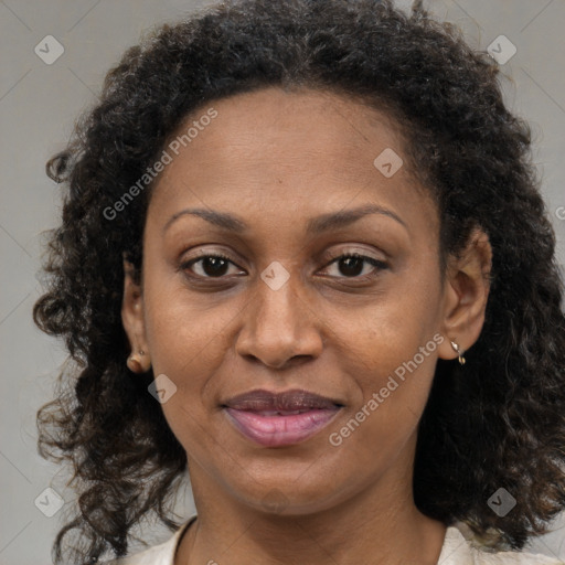 Joyful black adult female with medium  brown hair and brown eyes