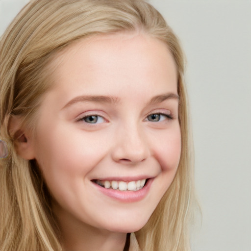 Joyful white young-adult female with long  brown hair and blue eyes