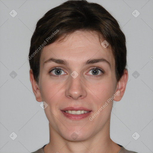 Joyful white young-adult female with short  brown hair and grey eyes