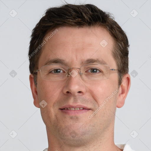 Joyful white adult male with short  brown hair and grey eyes