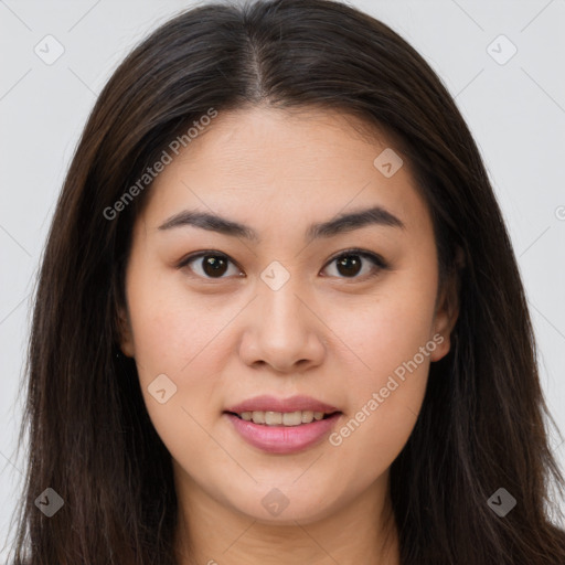 Joyful asian young-adult female with long  brown hair and brown eyes