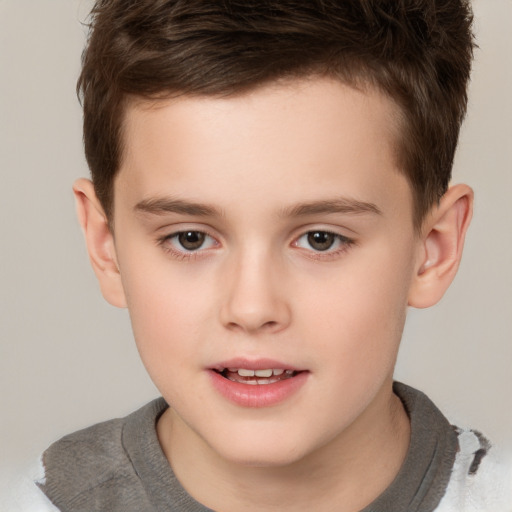 Joyful white child male with short  brown hair and brown eyes