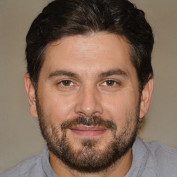 Joyful white adult male with short  brown hair and brown eyes