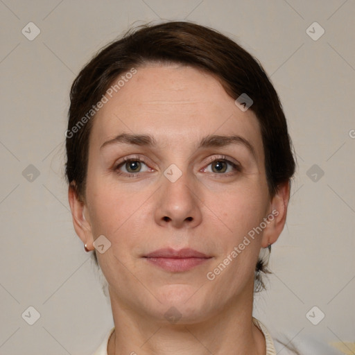 Joyful white adult female with short  brown hair and grey eyes