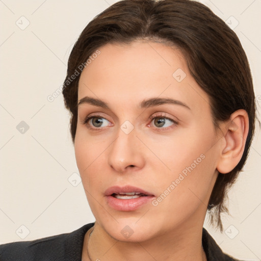 Neutral white young-adult female with medium  brown hair and brown eyes