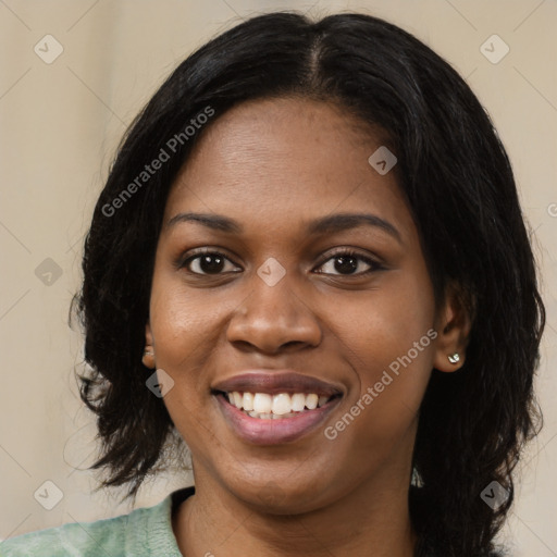 Joyful black young-adult female with medium  black hair and brown eyes