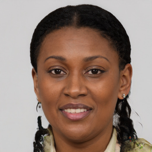 Joyful black young-adult female with medium  black hair and brown eyes
