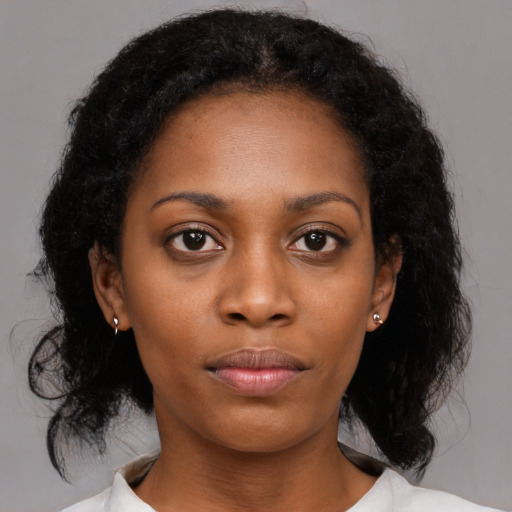 Neutral black young-adult female with medium  black hair and brown eyes