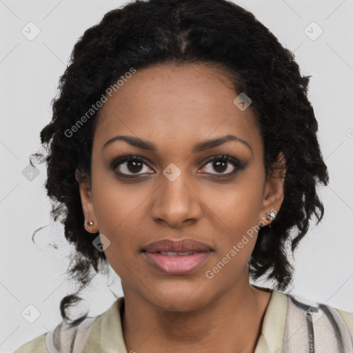 Joyful black young-adult female with long  black hair and brown eyes