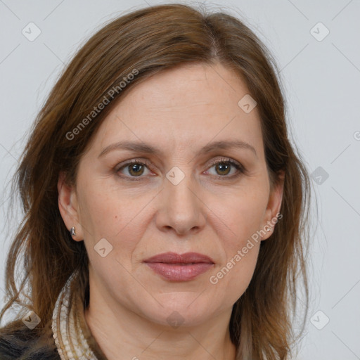 Joyful white adult female with medium  brown hair and brown eyes