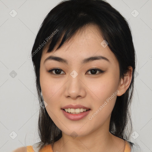 Joyful asian young-adult female with medium  black hair and brown eyes