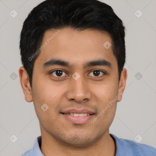 Joyful latino young-adult male with short  brown hair and brown eyes