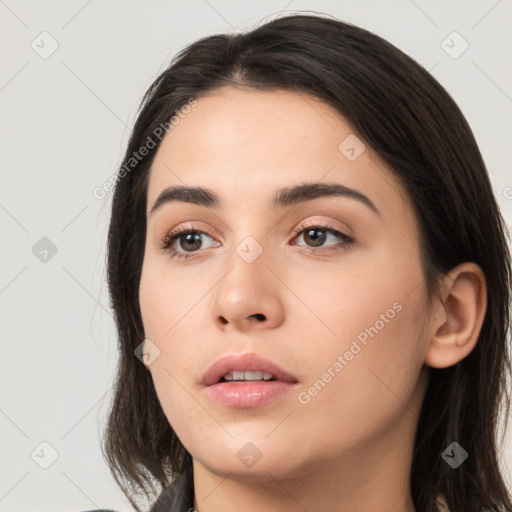 Neutral white young-adult female with long  black hair and brown eyes