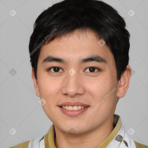 Joyful asian young-adult male with short  brown hair and brown eyes