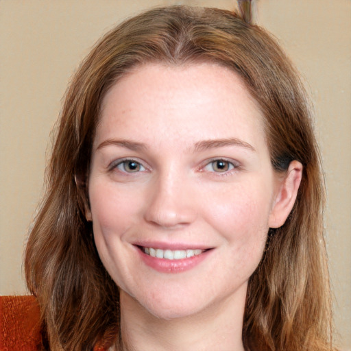 Joyful white young-adult female with long  brown hair and grey eyes