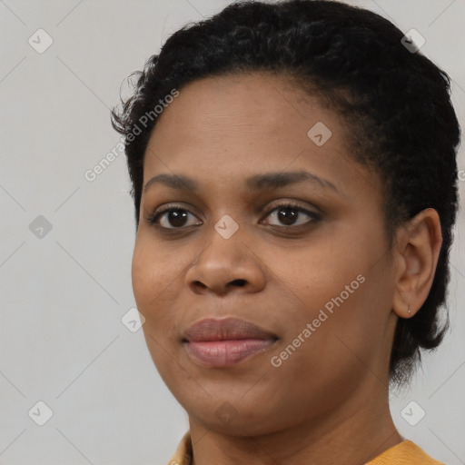 Joyful black young-adult female with short  black hair and brown eyes