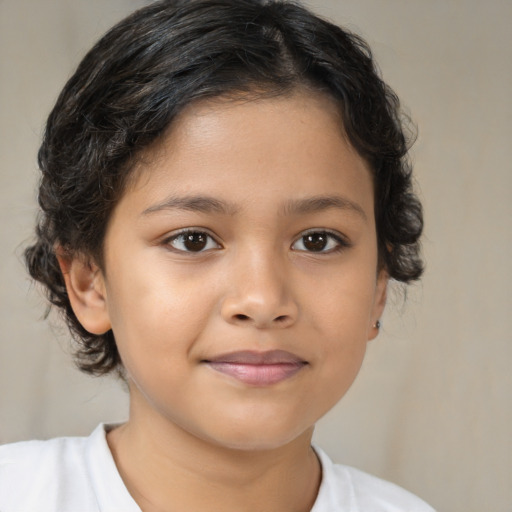 Joyful latino child female with medium  brown hair and brown eyes