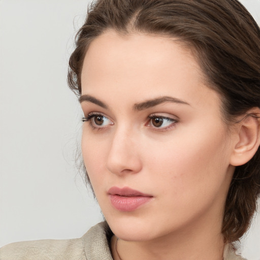 Neutral white young-adult female with medium  brown hair and brown eyes