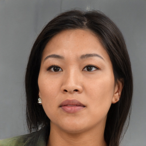 Neutral asian young-adult female with medium  brown hair and brown eyes