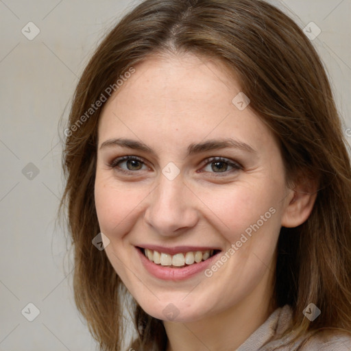 Joyful white young-adult female with long  brown hair and grey eyes