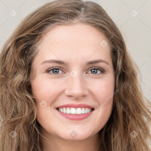 Joyful white young-adult female with long  brown hair and green eyes