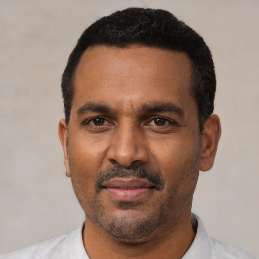 Neutral latino adult male with short  black hair and brown eyes