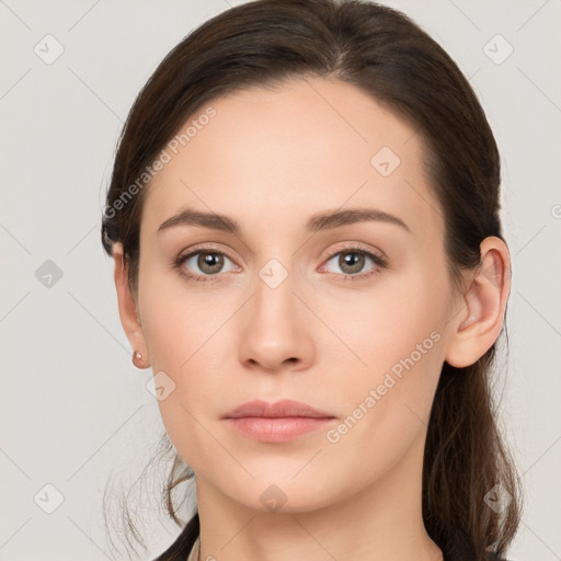 Neutral white young-adult female with long  brown hair and brown eyes