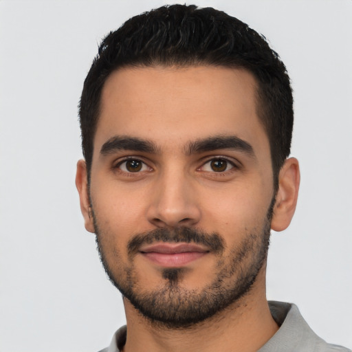 Neutral latino young-adult male with short  black hair and brown eyes