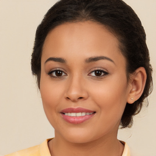 Joyful white young-adult female with medium  brown hair and brown eyes