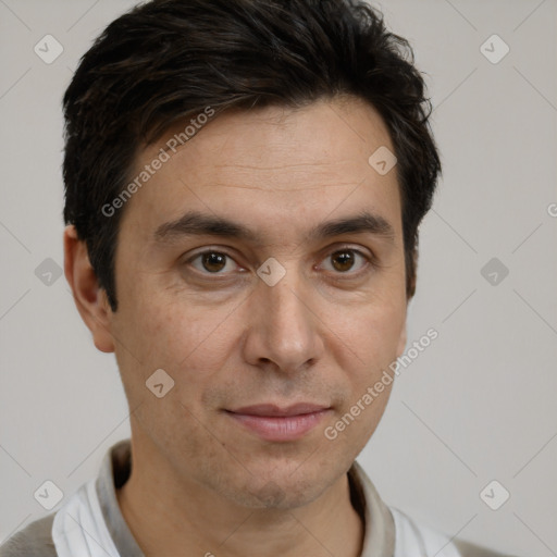 Joyful white adult male with short  brown hair and brown eyes