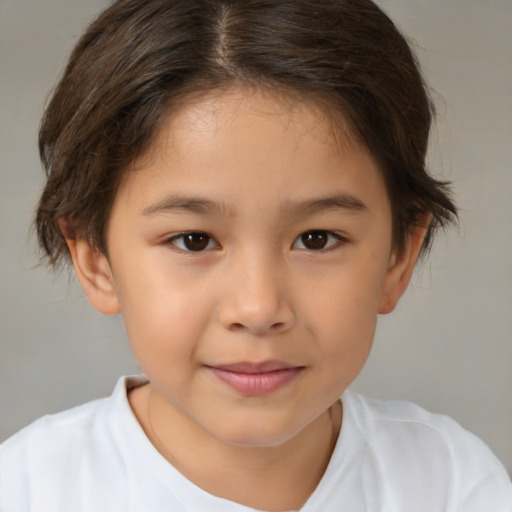 Joyful white child female with short  brown hair and brown eyes