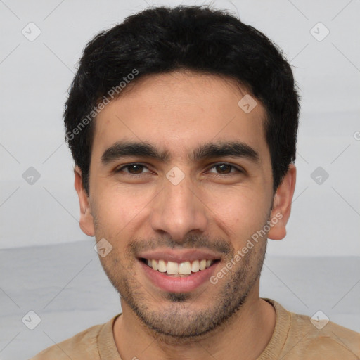 Joyful white young-adult male with short  black hair and brown eyes