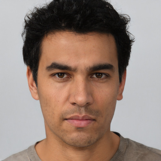 Neutral white young-adult male with short  black hair and brown eyes