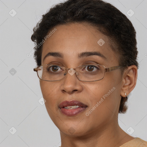 Joyful black adult female with short  brown hair and brown eyes