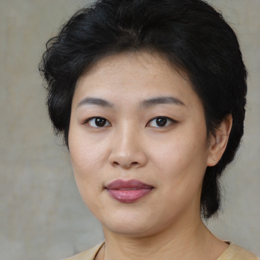 Joyful white young-adult female with medium  black hair and brown eyes