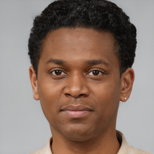Neutral black young-adult male with short  black hair and brown eyes
