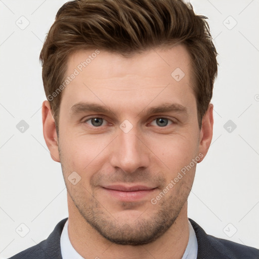 Joyful white young-adult male with short  brown hair and grey eyes