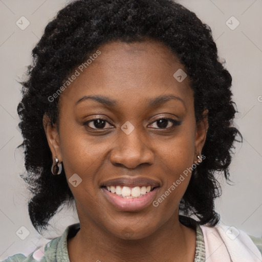 Joyful black young-adult female with long  brown hair and brown eyes