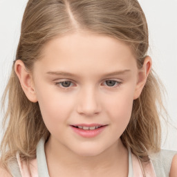 Joyful white child female with medium  brown hair and grey eyes