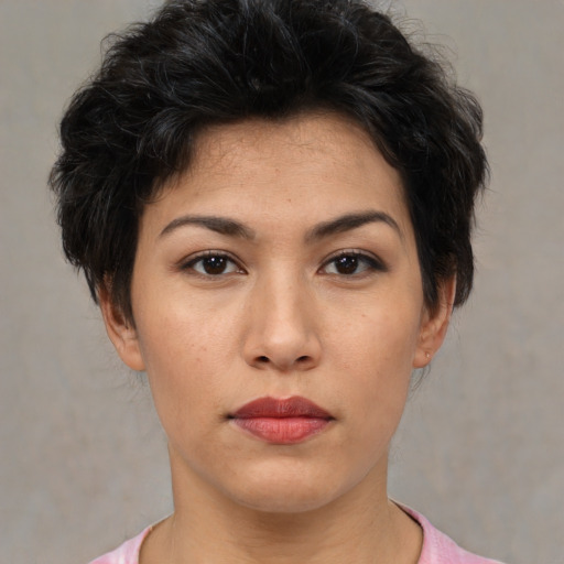 Joyful asian young-adult female with short  brown hair and brown eyes