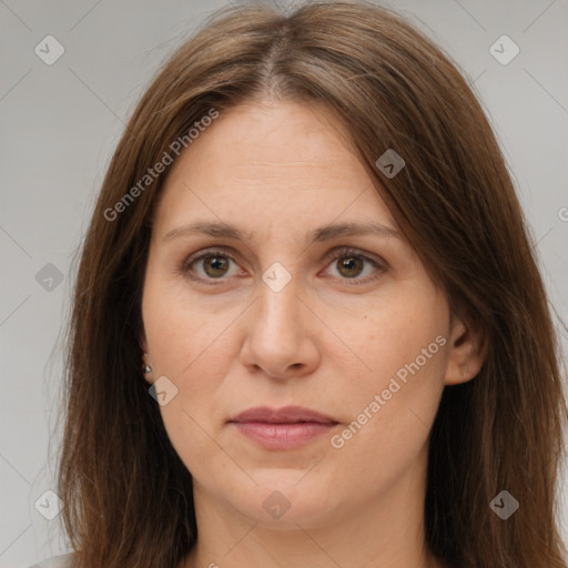 Joyful white adult female with long  brown hair and brown eyes