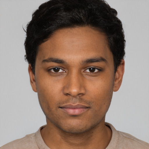 Neutral black young-adult male with short  black hair and brown eyes