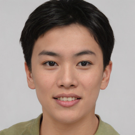 Joyful asian young-adult female with short  brown hair and brown eyes