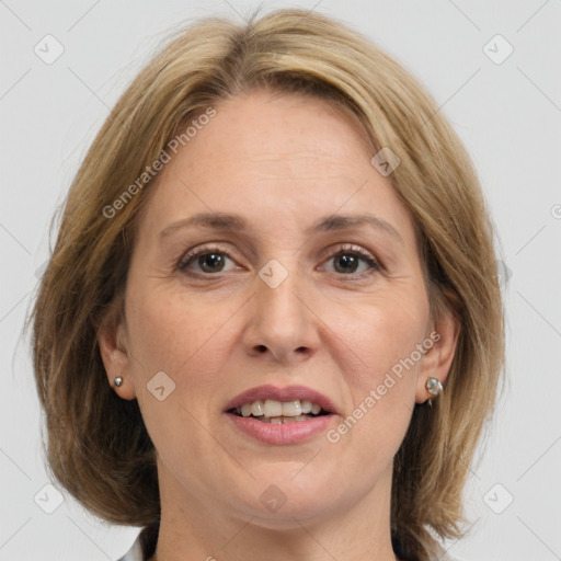 Joyful white adult female with medium  brown hair and grey eyes