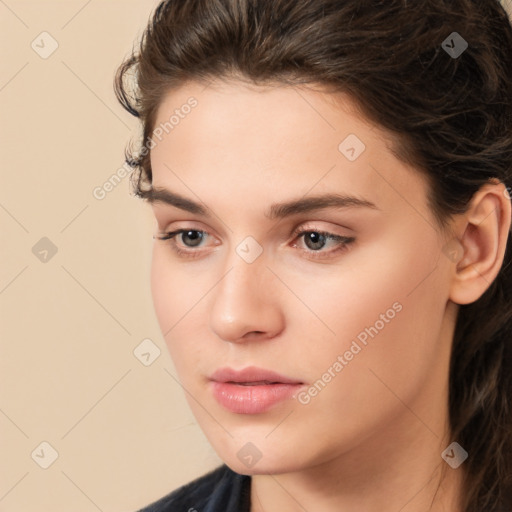 Neutral white young-adult female with long  brown hair and brown eyes