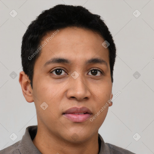 Joyful latino young-adult male with short  black hair and brown eyes