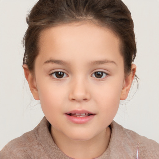 Joyful white child female with short  brown hair and brown eyes