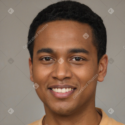 Joyful black young-adult male with short  black hair and brown eyes